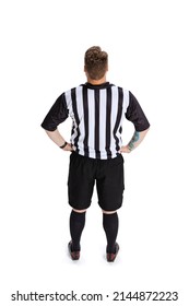 Back view. Full-length portrait of soccer or football referee wearing field judge uniform isolated on white studio background. Concept of sport, rules, competitions, rights, ad, sales. Funny meme