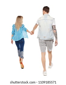  Back View Of Going Couple. Walking Friendly Girl And Guy Holding Hands. Rear View People Collection. Backside View Of Person. Isolated Over White. A Happy Couple Is Running Around Holding Hands.