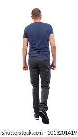 Back view of going  handsome man. walking young guy . Rear view people collection.  backside view of person.  Isolated over white background. a guy in trousers and a blue T-shirt goes away