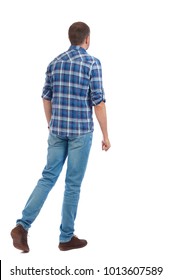 Back view of going  handsome man. walking young guy . Rear view people collection.  backside view of person.  Isolated over white background. The man in a blue shirt goes sideways.