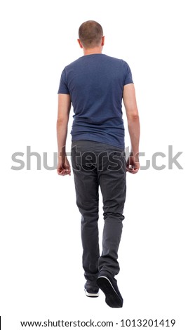 Back view of going  handsome man. walking young guy . Rear view people collection.  backside view of person.  Isolated over white background. a guy in trousers and a blue T-shirt goes away