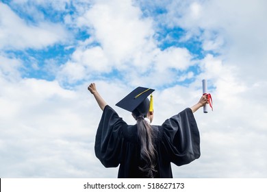 Back View Of Graduate Student Girl Hug Future And Look Up To Copy Space, She Wear Graduation Cap And Gown ,asian Woman  