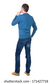 Back View Of Handsome Man In Blue Pullover. Standing Young Guy In Cardigan. Rear View People Collection.  Backside View Of Person.  Isolated Over White Background.