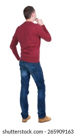 Back view of handsome man in blue pullover. Standing young guy in cardigan. Rear view people collection.  backside view of person.  Isolated over white background.