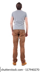 Back View Of Handsome Man In Shirt And Jeans  Looking Up.   Standing Young Guy. Rear View People Collection.  Backside View Of Person.  Isolated Over White Background.