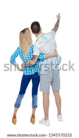 Back  view of a heterosexual couple who hugs and points out. Rear view people collection.  backside view of person.  Isolated over white background. A pair of crouching looks at something in the sky.