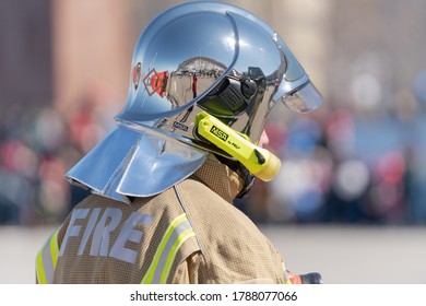 Back View Of Inscription Fire On Uniform Firefighter Emercom Of Russia, Ministry Of Civil Defence, Emergencies And Disaster Relief Russian Federation MChS. Kamchatka Peninsula, Russia - April 27, 2019