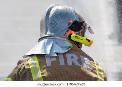 Back View Of Inscription Fire On Uniform Firefighter Emercom Of Russia, Ministry Of Civil Defence, Emergencies And Disaster Relief Russian Federation MChS. Kamchatka, Russia - April 27, 2019