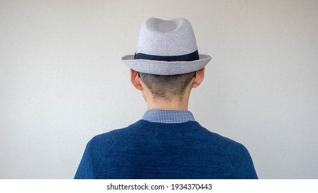 Back view of a Japanese man wearing a hat:Middle position
