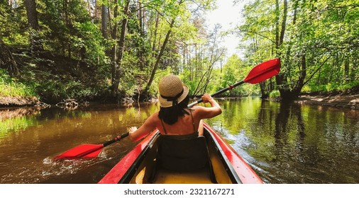 Back view Kayaking couple in river. POV of woman and man kayaking in beautiful landscape. Aquatic sports during fall autumn concept.Beautiful calm relaxing warm scenic trees autumn - Powered by Shutterstock