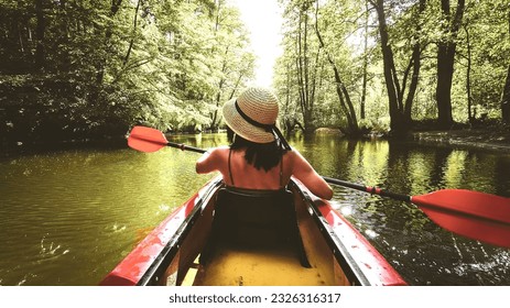 Back view Kayaking couple in river. POV of woman tandem kayaking in beautiful landscape. Aquatic sports during fall autumn concept.Beautiful calm relaxing warm scenic trees autumn - Powered by Shutterstock