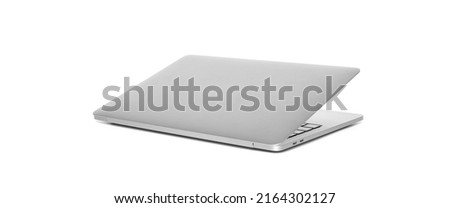 Back view of laptop half closed. Computer notebook isolated on white background