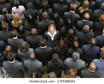 Back view of large group of business people woman facing opposite direction elevated view