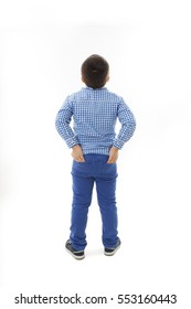Back view of little boy looking at wall. Rear view. Isolated on white background 