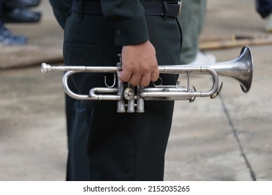 Back View Of Male Army Musicians Performing A Trumpet Show. At An Outdoor Jazz Event