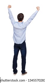 Back View Of A Man Celebrating Victory. The Fan Joyfully Raised His Hands Up. Rear View People Collection. Backside View Of Person. Isolated Over White Background. The Guy In The Shirt Is Happy.