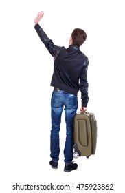 Back View Of Man With Green Suitcase Man Greeting Waving From His Hands. Traveler Is Carrying A Suitcase Waving Goodbye.