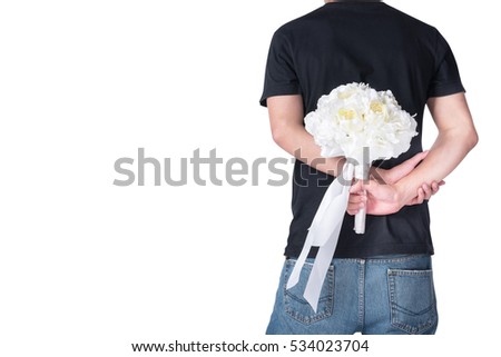 Similar – Man in jeans and plaid shirt with some white flowers in his hand