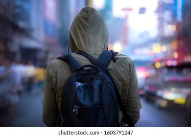 Back view of  man posing with winter hood on road