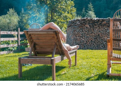 Back view of a man relaxing on a sunbed on the beach. No worries at all. Natural. Tree. Enjoy. Glad. Greenery. Privacy. Thinking. Thinks. Sun. Guy. Hispanic. Relaxing. Male. Resting