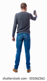 Back View Of Man In Suit  Talking On Mobile Phone.    Rear View People Collection. Isolated Over White Background. Backside View Of Person. A Guy In A Gray Sweater Looking In The Phone.