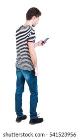  Back View Of Man In Suit  Talking On Mobile Phone.    Rear View People Collection. Isolated Over White Background. Backside View Of Person. The Guy In The Striped Shirt Looking At The Cell Phone.