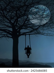 Back view of man swinging on the wooden swing on big leafless tree. Scenic landscape. view of unrecognisable man swinging on swing with rope under mountains. full moon behind branches. above mountains