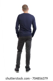 Back View Man In Trousers. Standing Young Guy. Rear View People Collection.  Backside View Person. Isolated Over White Background. Man In Black Pants And Sneakers Looks Thoughtfully Into The Distance.