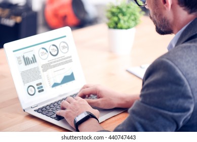 Back View Of Man Working On Laptop