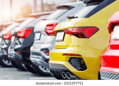 Back view many modern new multicolored SUV cars fleet stock dealership parking lot. Automobile market production factory industry warehouse. Auto salvage buy and sell auction purchase seller platform - Powered by Shutterstock