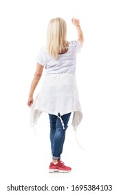 Back View Of Mid Age Blond Casual Woman Shopper With Raised Hand Reaching For Product. Full Body Length Isolated On White Background.