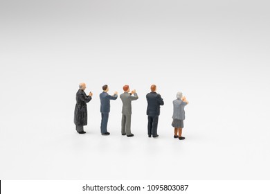 Back View Of Miniature People Happy Team Member, Colleague Or Audiences Clapping Appreciating After Success In Work, Reach Goal Or Target Or Meeting On White Background.