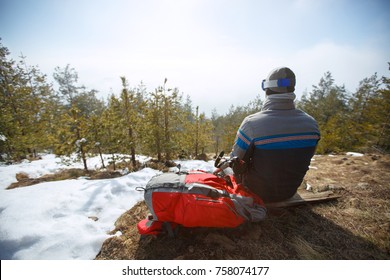  Back view of mountaineers while sitting and resting from mountaineering