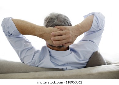 Back View Of Old Man Relaxing In Sofa