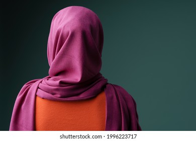 Back View Photo Of Muslim Woman In Hijab Posing At Camera Isolated Over Grey Background