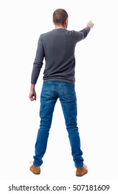 Back View Of Pointing Business Man. Rear View People Collection.  Backside View Of Person.  Isolated Over White Background. A Guy In A Gray Sweater Shows His Hand To The Side.