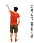 Back view of pointing young men in orange t shirt and shorts. Young guy gesture. Rear view people collection. backside view of person. Isolated over white background. 