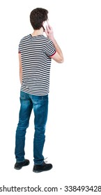 Back View Of  Pointing Young Men Talking On Cell Phone. Young Guy  Gesture. Rear View People Collection.  Backside View Of Person.  Isolated Over White Background. 
