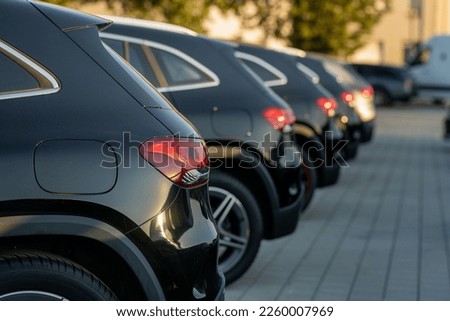 A back view of Porsche cayenne cars parked in row