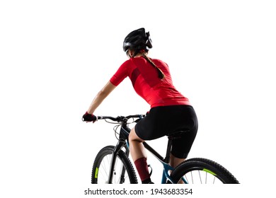 Back view. Portrait of female professional cycling athlete, young woman on road bicycle practicing isolated on white studio background. Concept of sport, acton, motion, speed, race. Copy space for ad.