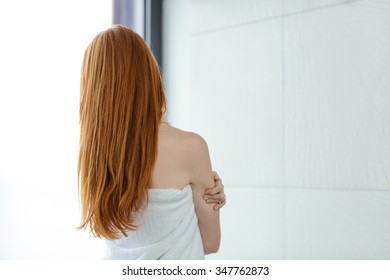 Back View Portrait Of A Redhead Woman In Towel