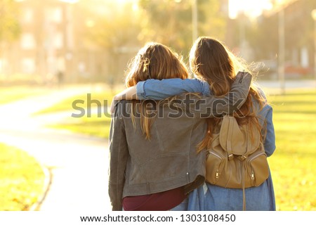 Similar – Image, Stock Photo two teenager girls walking and smiling on a street. front view