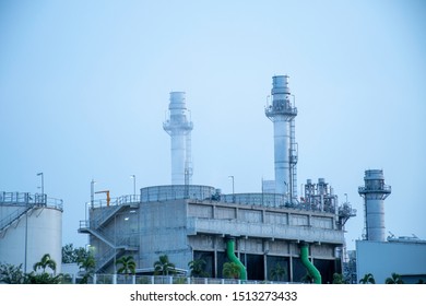Back view of power plant and evening refinery
