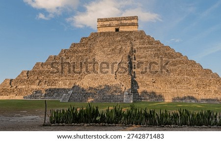 Back view of the pyramid showing the less restored side on a sunny day.