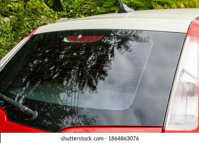 Back View Of Red Car Window For Sticker Mockup