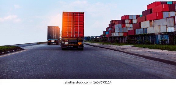Back view of Red Container truck in ship port Logistics.Transportation industry in port business concept.import,export logistic industrial Transporting Land transport on Port transportation storge  
