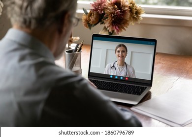 Back View Retired Old Man Holding Video Call Conversation, Consulting With Young Female Doctor Therapist Using Computer Application. Medical Insurance Modern Service. Distant Communication Concept.