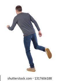 Back View Of Running  Man. Backside View Of Person.  Rear View People Collection. Isolated Over White Background. The Guy In The Gray Sweater Is Balancing On One Leg.