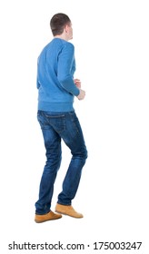 Back View Of Running Man In Blue Pullover. Walking Guy In Motion. Rear View People Collection.  Backside View Of Person. Isolated Over White Background.