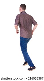 Back View Of Running Man In Brown Shirt. Walking Guy In Motion. Rear View People Collection. Backside View Of Person. Isolated Over White Background.